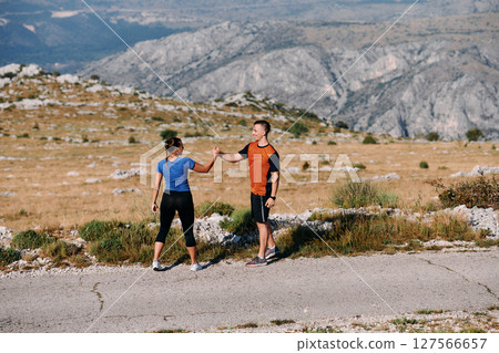 Joyful Couple Celebrating the Successful Completion of a Morning Run. 127566657