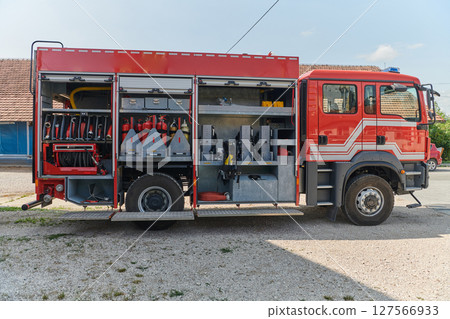 Close-up of essential firefighting equipment on a modern firetruck, showcasing tools and gear ready for emergency response to hazardous fire situations 127566933