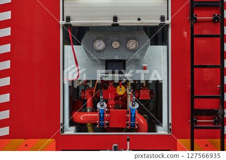 Close-up of essential firefighting equipment on a modern firetruck, showcasing tools and gear ready for emergency response to hazardous fire situations 127566935