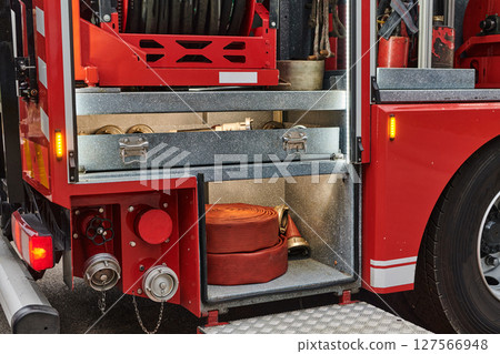 Close-up of essential firefighting equipment on a modern firetruck, showcasing tools and gear ready for emergency response to hazardous fire situations 127566948