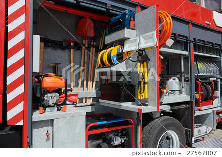 Close-up of essential firefighting equipment on a modern firetruck, showcasing tools and gear ready for emergency response to hazardous fire situations 127567007