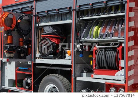 Close-up of essential firefighting equipment on a modern firetruck, showcasing tools and gear ready for emergency response to hazardous fire situations 127567014