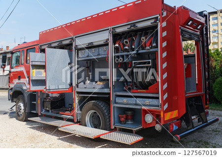 Close-up of essential firefighting equipment on a modern firetruck, showcasing tools and gear ready for emergency response to hazardous fire situations 127567019