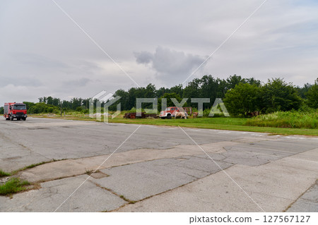 In this captivating scene, a state-of-the-art firetruck, equipped with advanced rescue technology, stands ready with its skilled firefighting team, prepared to intervene and respond rapidly to 127567127