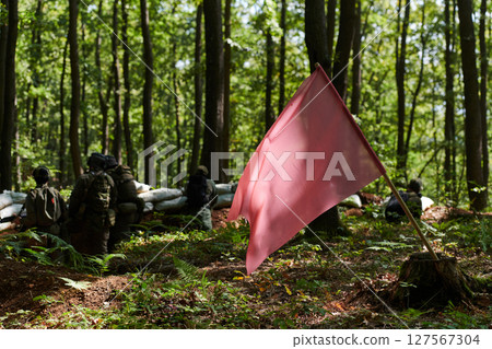 A disciplined and specialized military unit, donned in camouflage, strategically patrolling and maintaining control in a high-stakes environment, showcasing their precision, unity, and readiness for 127567304