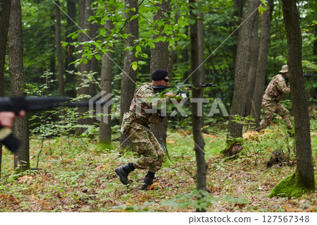 A disciplined and specialized military unit, donned in camouflage, strategically patrolling and maintaining control in a high-stakes environment, showcasing their precision, unity, and readiness for 127567348