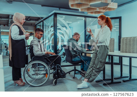 Young group of business people brainstorming together in a startup space, discussing business projects, investments, and solving challenges. Young group of business people brainstorming together in a startup space, discussing business projects, investments, and solving challenges. 127567623