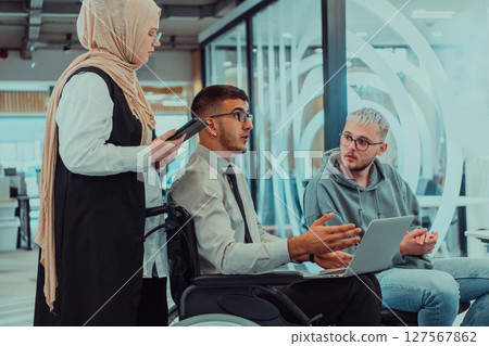 Young group of business people brainstorming together in a startup space, discussing business projects, investments, and solving challenges. 127567862