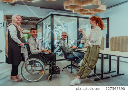 Young group of business people brainstorming together in a startup space, discussing business projects, investments, and solving challenges. 127567890