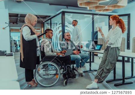 Young group of business people brainstorming together in a startup space, discussing business projects, investments, and solving challenges. Young group of business people brainstorming together in a startup space, discussing business projects, investments, and solving challenges. 127567893