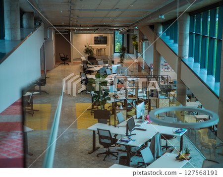 Empty modern glass startup office the space exudes a sleek and innovative atmosphere, ready to be filled with the potential of entrepreneurial endeavors 127568191