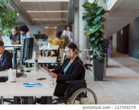 In a modern startup office, a diverse group of young professionals collaboratively tackles various business problems and challenges, surrounded by their engaged colleagues, fostering innovation and 127568279
