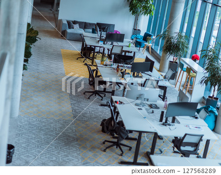 Empty modern glass startup office the space exudes a sleek and innovative atmosphere, ready to be filled with the potential of entrepreneurial endeavors 127568289