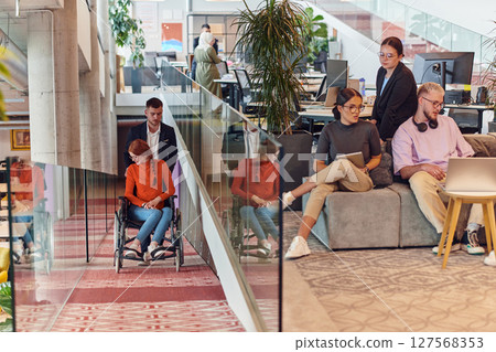 A company director assists his business colleague in a wheelchair, helping her navigate to their startup office, where they work alongside their diverse team of colleagues, emphasizing inclusivity and 127568353