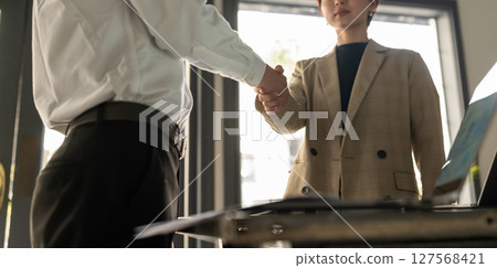 A woman shaking hands A woman shaking hands 127568421