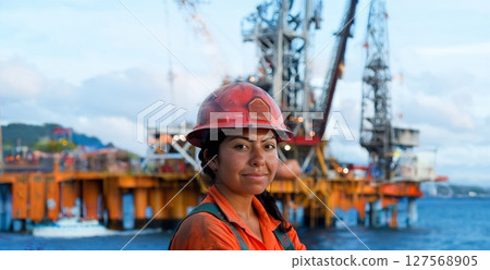 Woman in Protective Gear and Helmet Working on Oilfield Construction Site.Generated image 127568905