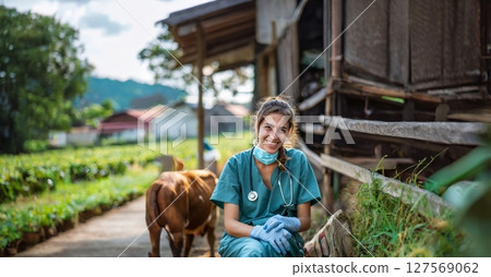 Smiling Young Female Veterinarian in Uniform Caring for Animals on Farm.Generated image 127569062