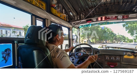 Smiling Woman Driving a Bus.Generated image 127569187