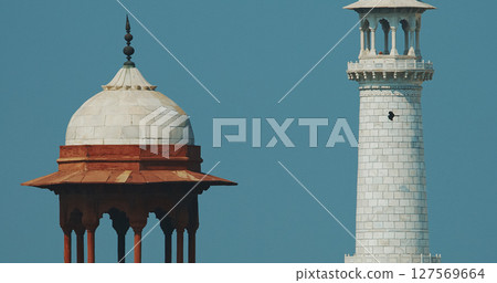 Agra, Uttar Pradesh, India. Black Kites Flying In Motion Above Taj Mahal Towers. Clear Blue Sky. Seven World Wonders. Fabulous Taj Mahal Travel Concept. Indian Islamic Heritage At Sunny Day. Marble 127569664