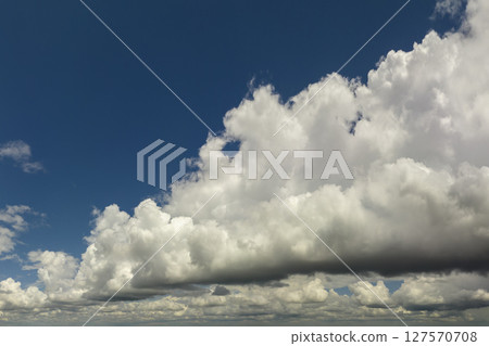 Blue sky with white clouds. Bright summer skyscape 127570708