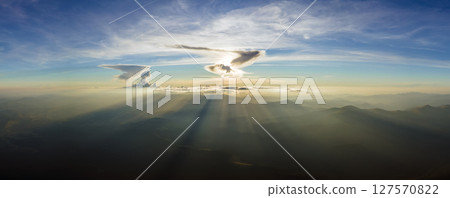 Beautiful mountain panoramic landscape with hazy peaks and foggy valley at sunset 127570822