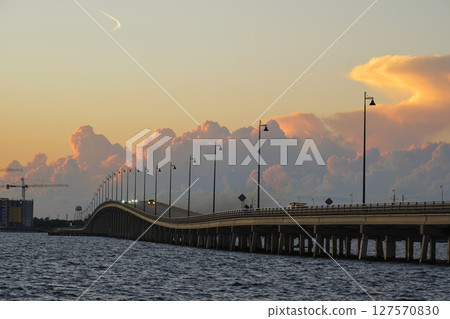 Barron Collier Bridge and Gilchrist Bridge in Florida with moving traffic. Transportation infrastructure in Charlotte County connecting Punta Gorda and Port Charlotte over Peace River 127570830