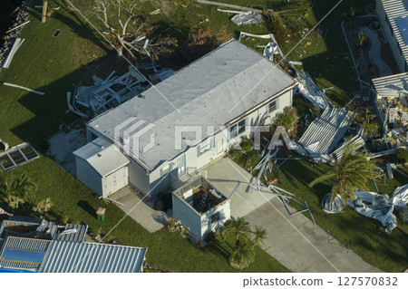 Badly damaged mobile homes after hurricane Ian in Florida residential area. Consequences of natural disaster 127570832