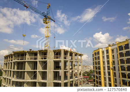 Apartment or office tall concrete building under construction. Apartment or office tall concrete building under construction. 127570840