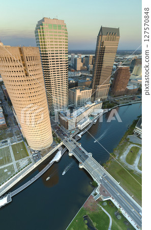 American city skyline of Tampa in Florida. Brightly illuminated commercial buildings and streets. Night urban landscape of downtown district in USA American city skyline of Tampa in Florida. Brightly illuminated commercial buildings and streets. Night urban landscape of downtown district in USA 127570848