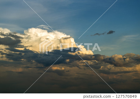 Amazing sunset skyscape. Evening sky with bright colorful orange and yellow clouds Amazing sunset skyscape. Evening sky with bright colorful orange and yellow clouds 127570849