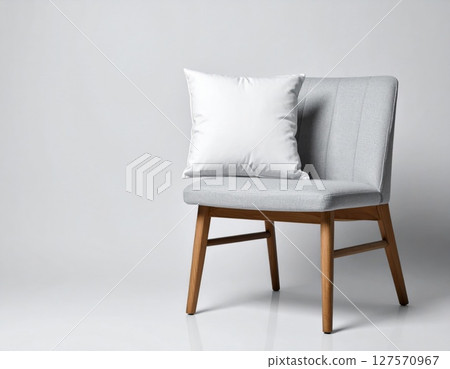 Gray Fabric Chair with White Pillow on Wooden Legs 127570967