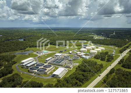 Aerial view of modern water cleaning facility at urban wastewater treatment plant. Purification process of removing undesirable chemicals, suspended solids and gases from contaminated liquid 127571865