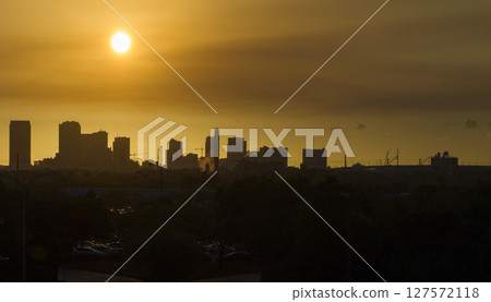 Aerial view of downtown district of Tampa city in Florida, USA at sunset. Dark silhouette of high skyscraper office buildings in modern american midtown 127572118