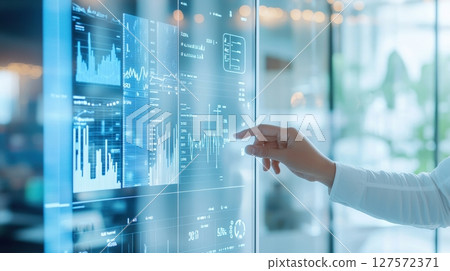 Analyzing data a hand interacting with a futuristic interface 127572371