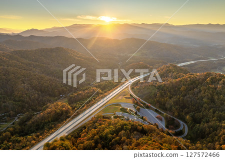 Aerial view of 4 Beech Glenn Parking rest area near busy I-26 American interstate freeway with fast moving cars and trucks. Recreational place between Appalachian hills during vacation travel concept 127572466