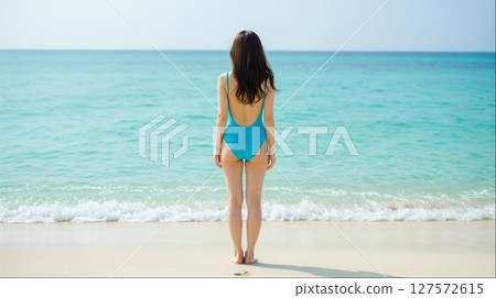 Summer sea and woman in swimsuit (resort beach landscape copy space) 127572615