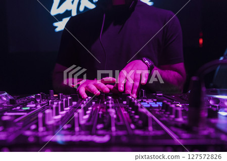 Close up view of a dj's hands Close up view of a dj's hands 127572826