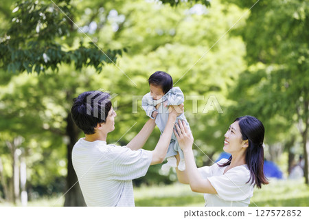 Family holding a baby 127572852