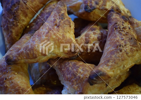 Flaky Triangular Pastries in a Bowl 127573046