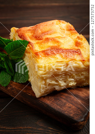 Achma, khachapuri, Georgian cuisine, homemade, no people, on a wooden background, Achma, khachapuri, Georgian cuisine, homemade, no people, on a wooden background, 127573752