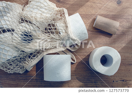 mesh bag on the table, with rolls of toilet paper, top view, no people, mesh bag on the table, with rolls of toilet paper, top view, no people, 127573770