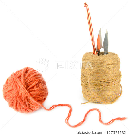 Ball of hemp rope,Ball of terracotta yarn, crochet hook and scissors isolated on white background. Ball of hemp rope,Ball of terracotta yarn, crochet hook and scissors isolated on white background. 127575582