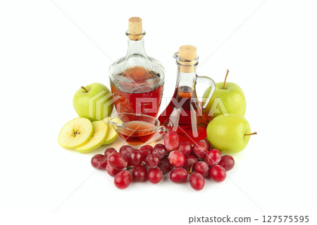 Apple cider and vinegar in a vintage bottle isolated on a white 127575595