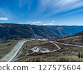Construction of a new road to the Chulyshman River valley. Mountain pass Katu-Yaryk. Landscape. Mountain dangerous road. 127575604