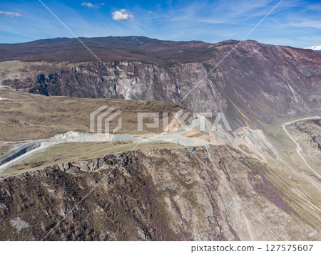 Construction of a new road to the Chulyshman River valley. Mountain pass Katu-Yaryk. Landscape. Mountain dangerous road. Construction of a new road to the Chulyshman River valley. Mountain pass Katu-Yaryk. Landscape. Mountain dangerous road. 127575607