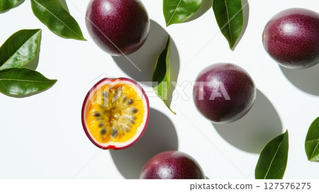 Whole and halved passion fruits float Whole and halved passion fruits float 127576275