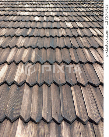 Old traditional wooden shingle roof Old traditional wooden shingle roof 127576418
