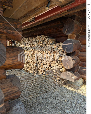 Cross-section background of a large number of firewood piles 127576421