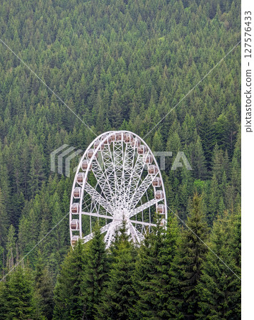 Ferris wheel in the mountains 127576433