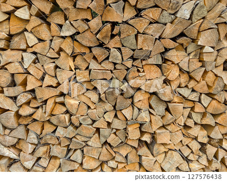 Cross-section background of a large number of firewood piles Cross-section background of a large number of firewood piles 127576438
